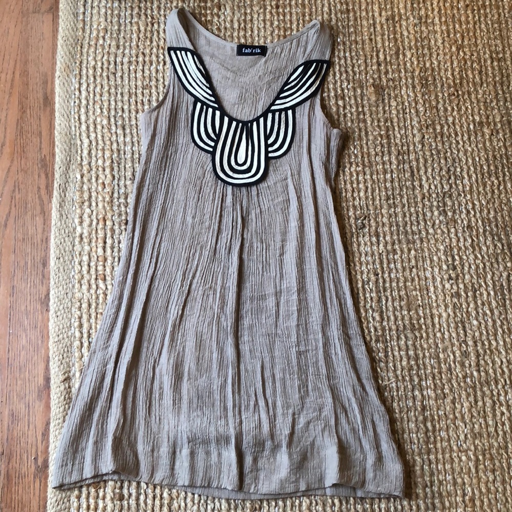 Tan with black and white sleeveless dress